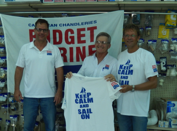 the presentation of the limited edition Aruba International Regatta t-shirt with from left to right Budget Marine main sponsors Tony Waldron and Robbie Ferron and regatta coordinator Eric Mijts